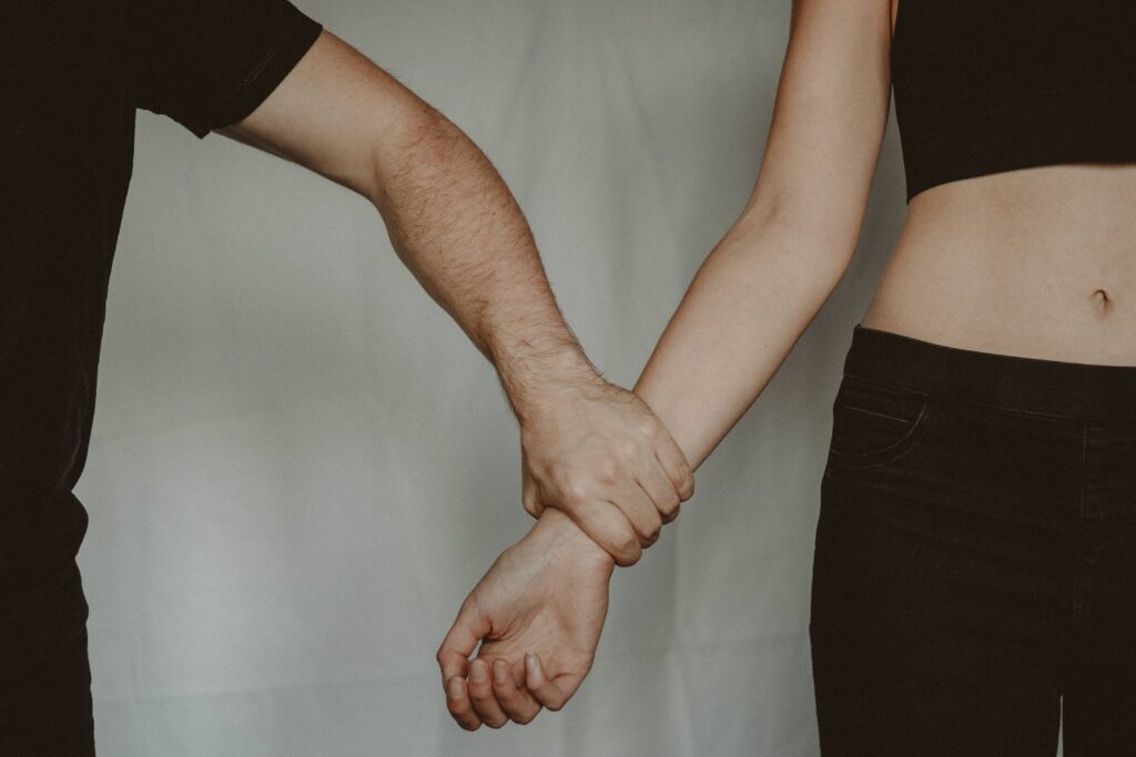 Photo by Anete Lusina: https://www.pexels.com/photo/crop-man-grasping-hand-of-woman-5723192/
